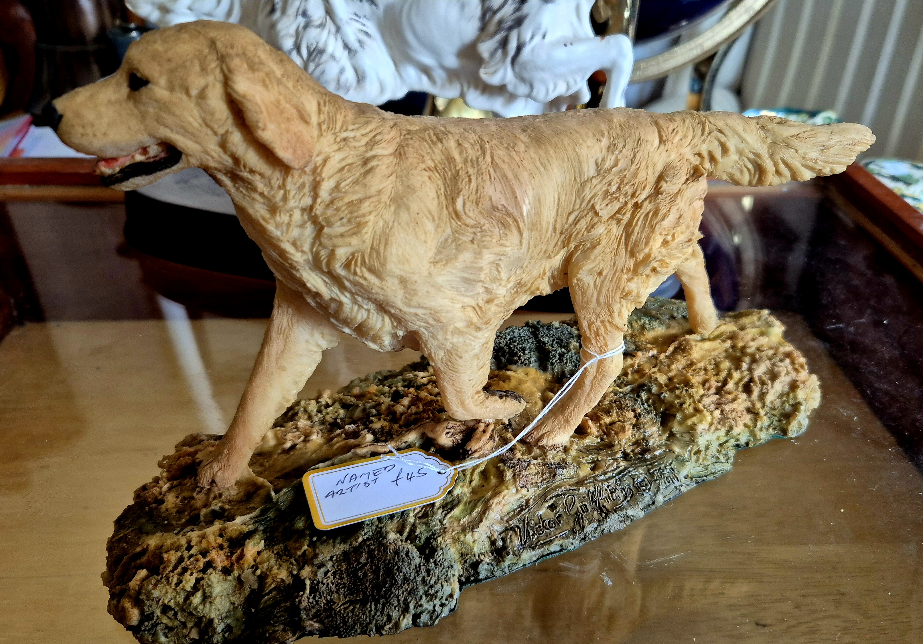 A vintage sandcast sculpture by the artist Sandra Brue of a 
