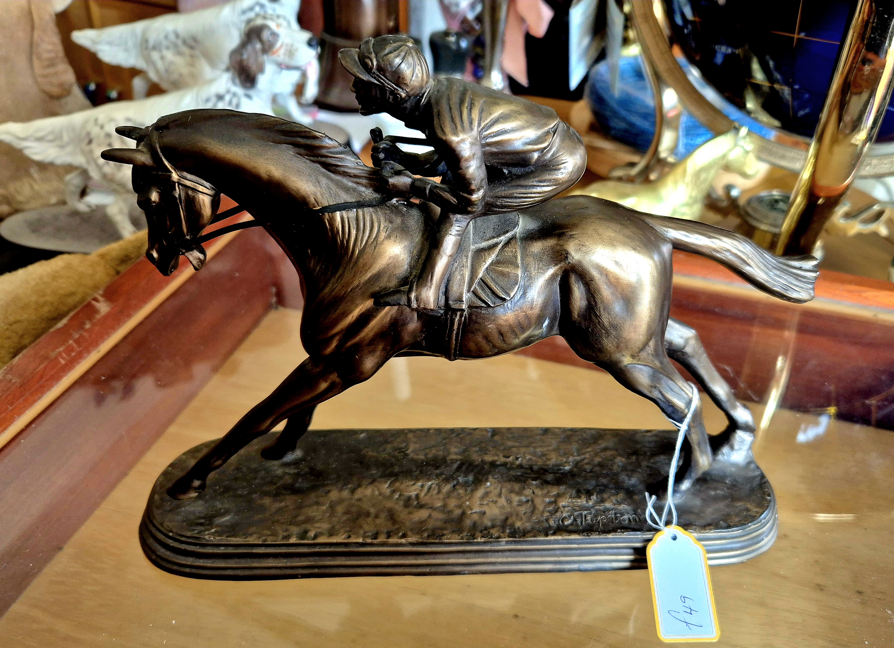 Sculpture of a racehorse O' Tipton signed by the artist.